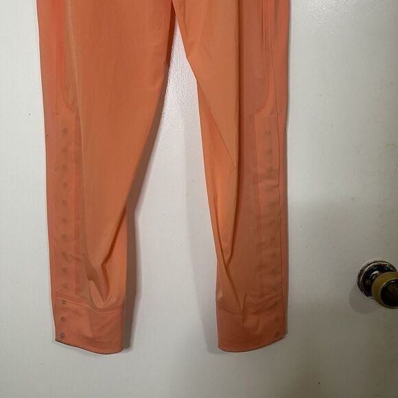 LULULEMON orange peach lightweight magnetic slit hem jogger pants 4 - Picture 6 of 8
